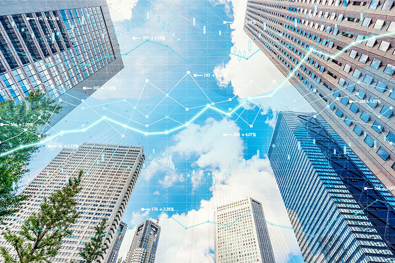 tall city buildings with a technical graph monetary overlay